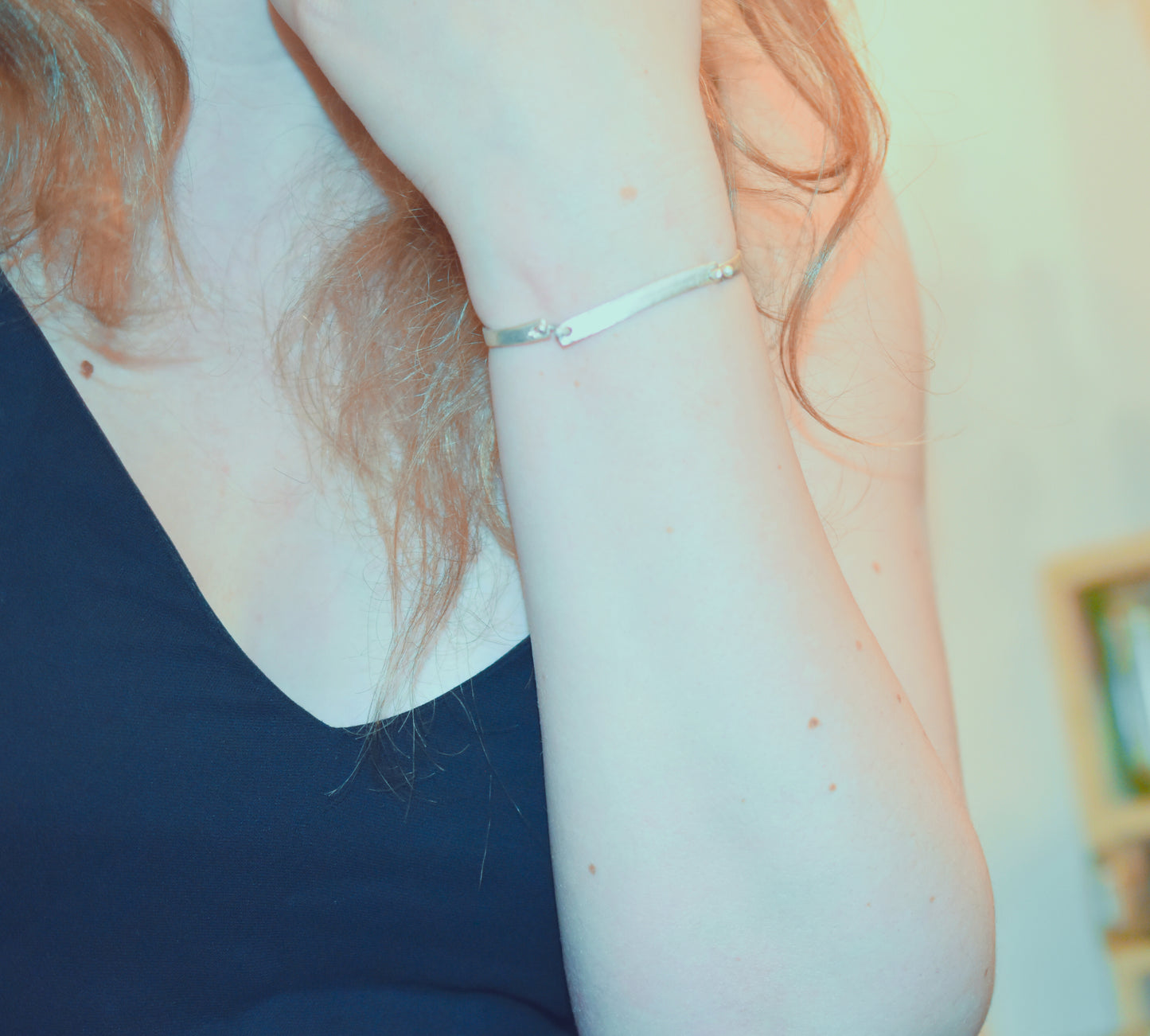 Orbit handmade silver bracelet shown worn on wrist