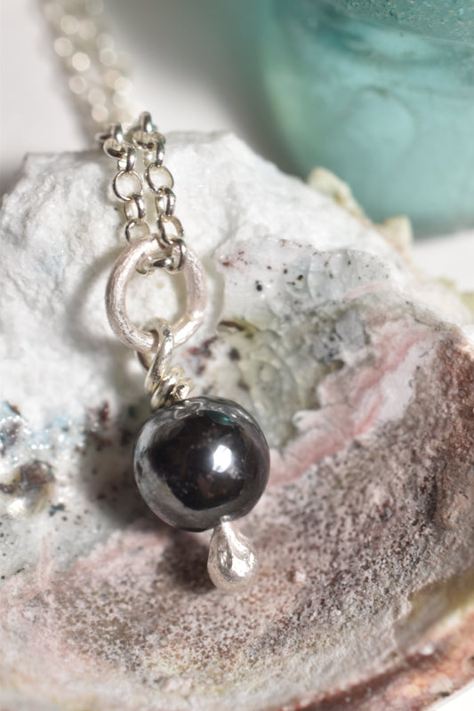 Silver hematite charm pendant, small handmade design, detail view