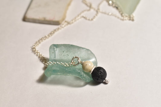 Silver lava stone pendant with white stone on sterling silver chain

