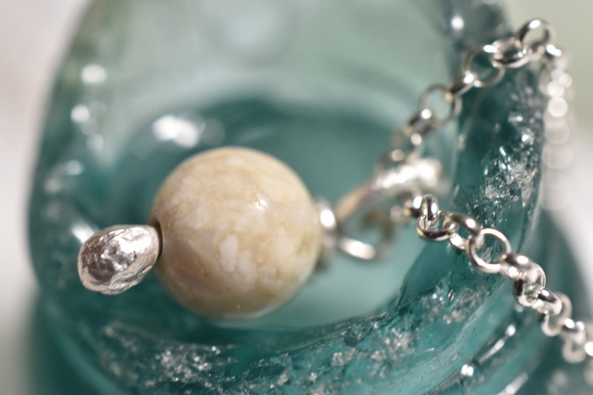 Silver white stone small charm attached to silver chain