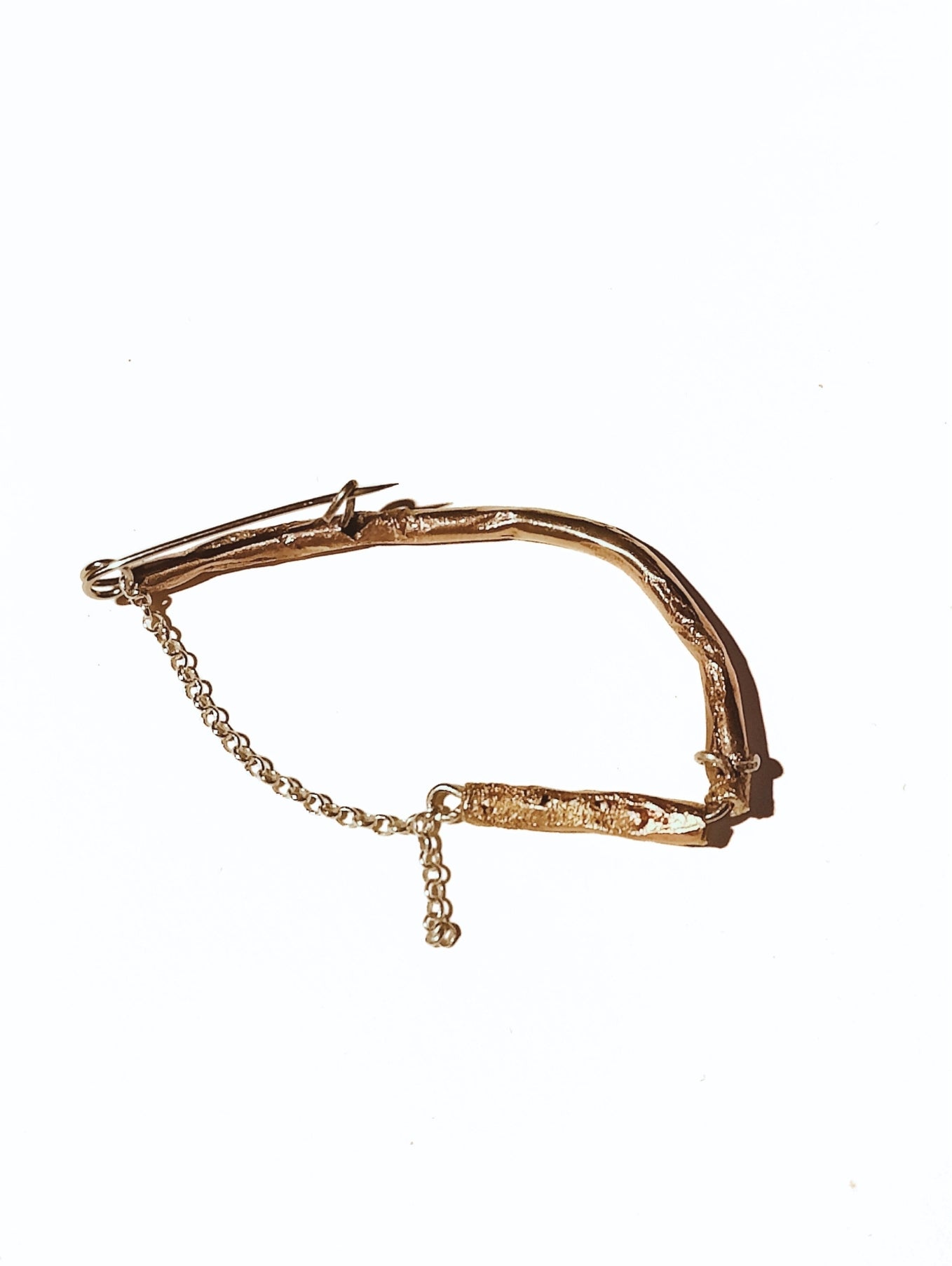 Fool's Gold brooch with brass accents, detail of materials