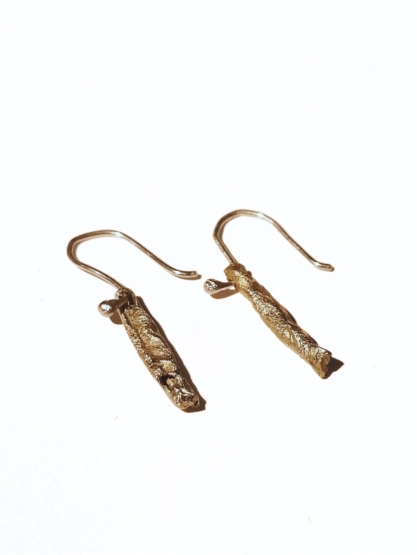 Short Fool's Gold handmade earrings, detail of brass shimmer
