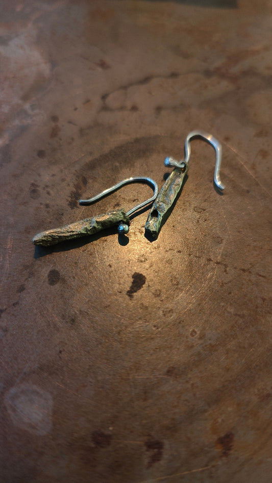 Short Fool's Gold earrings with brass and silver, close-up detail view