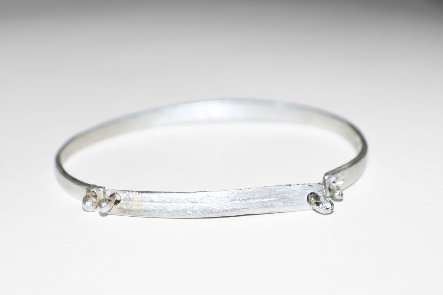 Orbit textured sterling silver bracelet, detail of brushed surface
