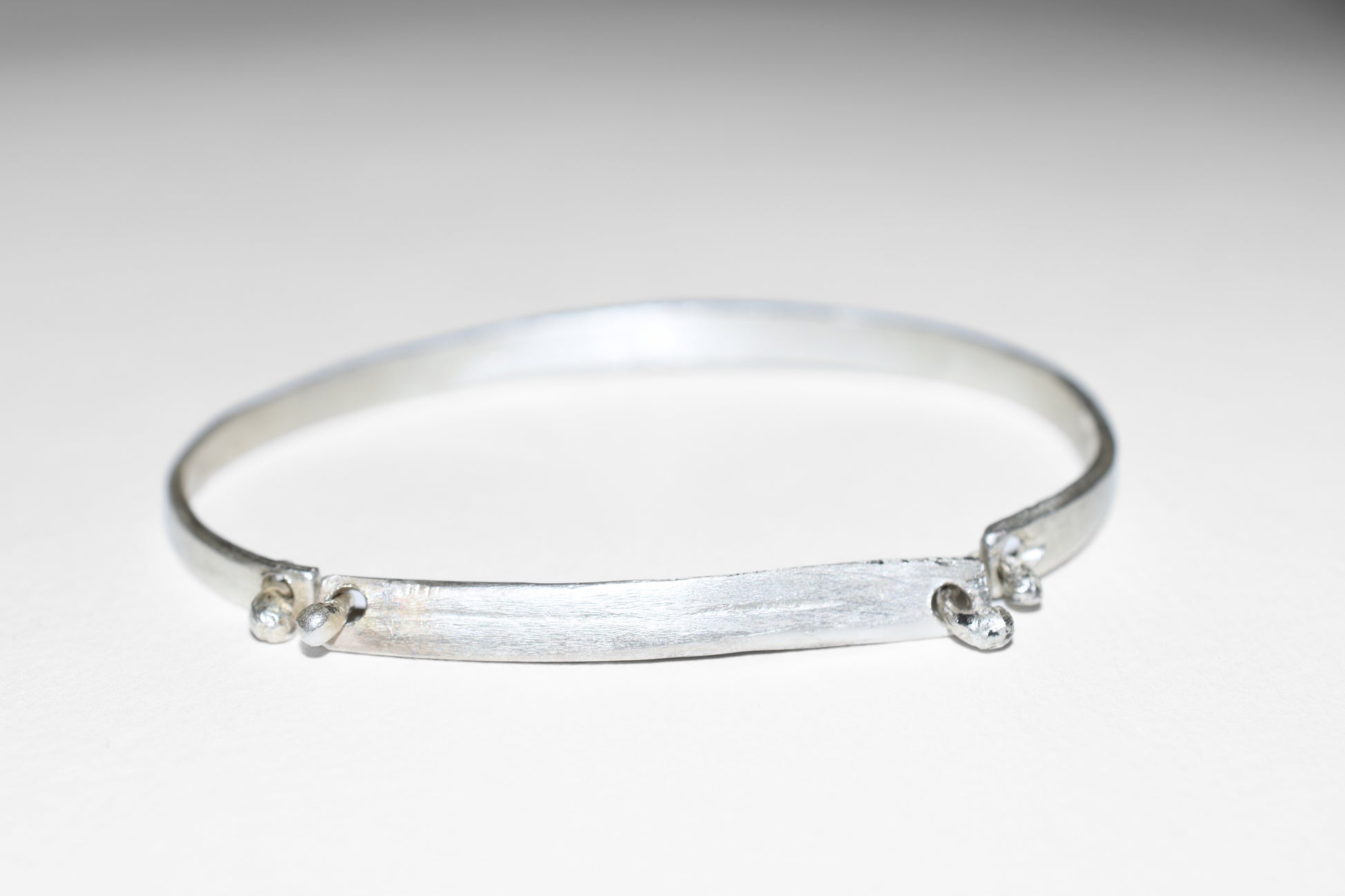 Orbit textured sterling silver bracelet, detail of brushed surface